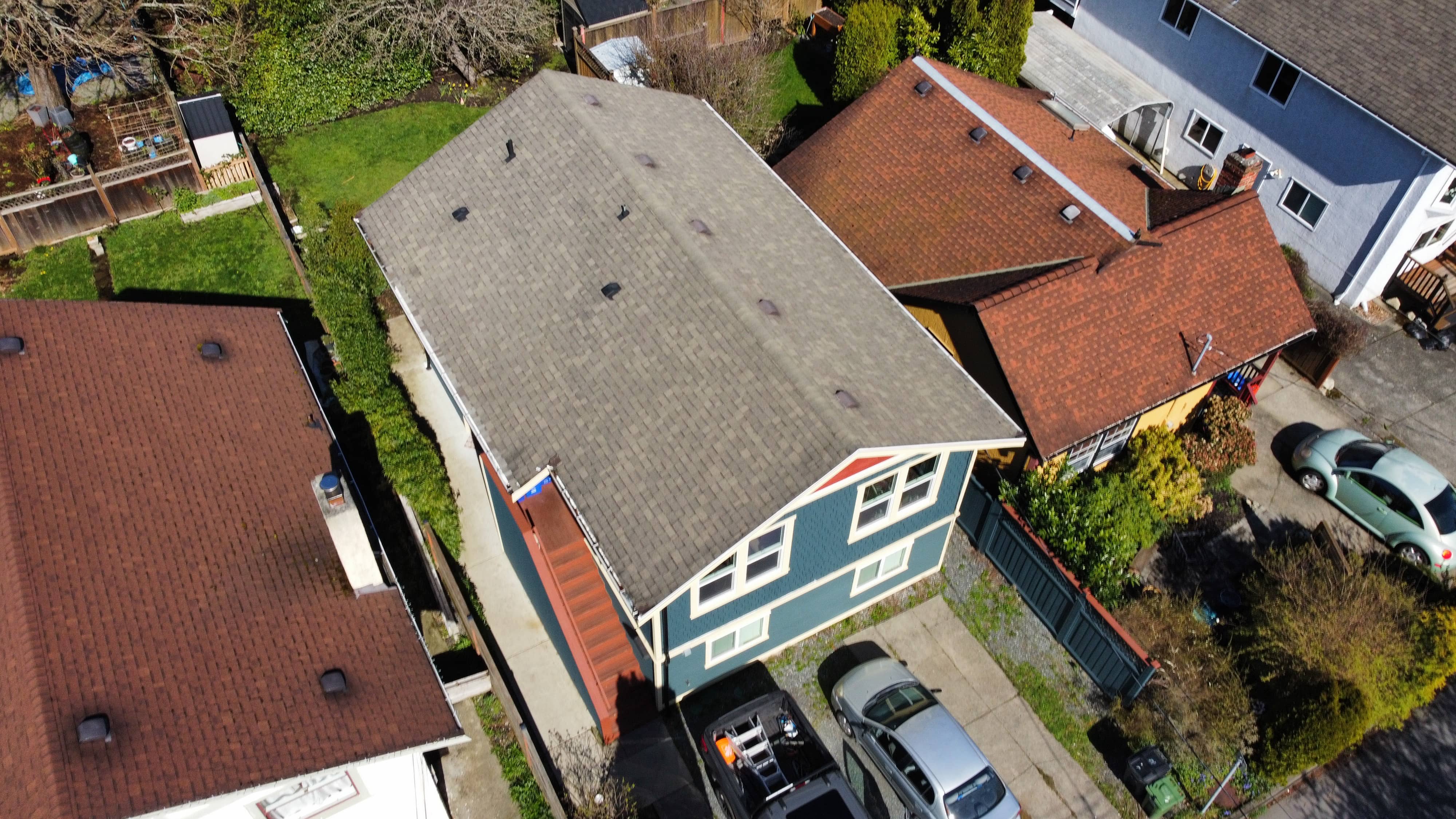 Before - worn shingles requiring roof replacement