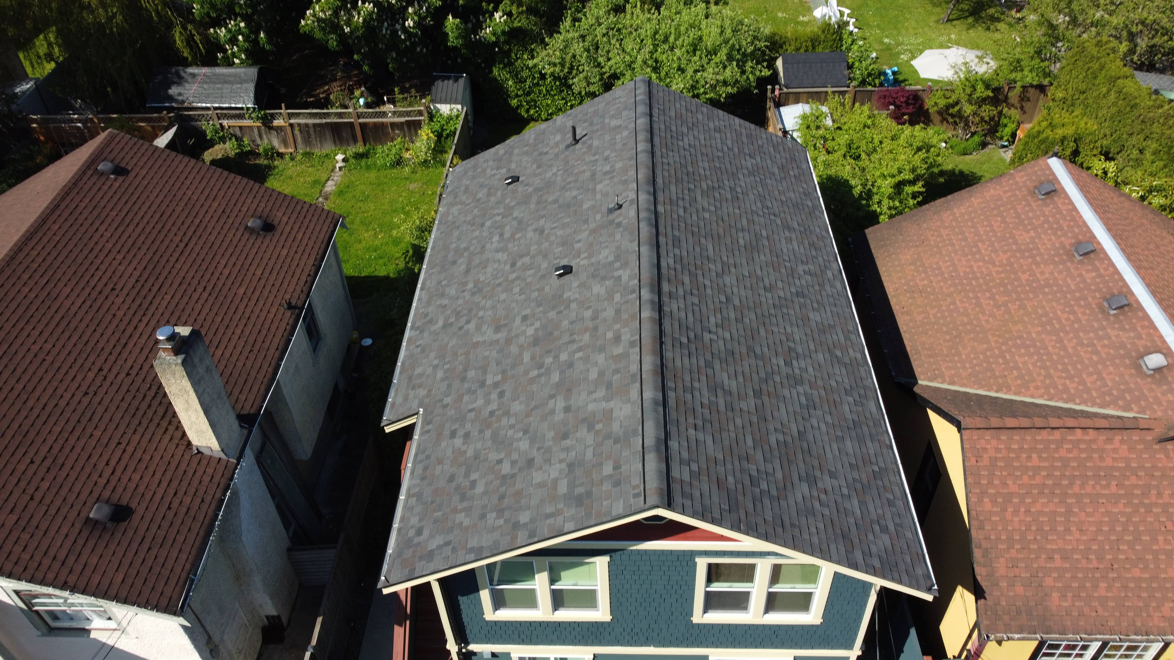 After - new asphalt shingle roof installed by McGuire Roofing