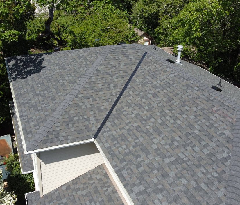 roofer performing a detailed roof inspection